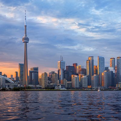 Landmarks of Toronto with the CN Tower, white stadium dome of the Rogers Centre, and the skyscrapers of the downtown business district.